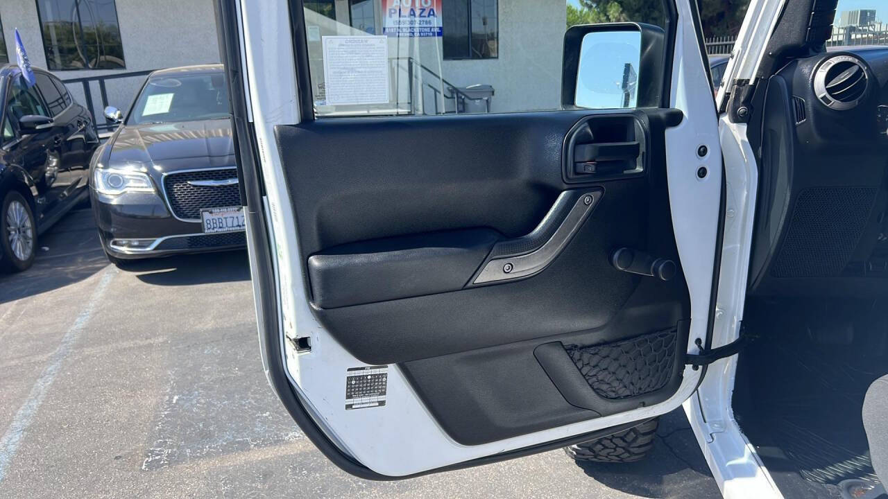 2012 Jeep Wrangler Unlimited for sale at Auto Plaza in Fresno, CA