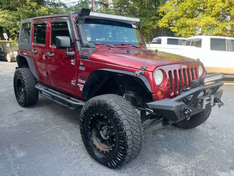 Used 2012 Jeep Wrangler Unlimited Sport with VIN 1C4BJWDGXCL217123 for sale in Roswell, GA