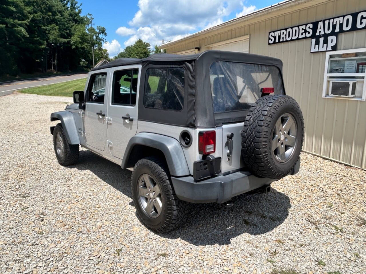 2012 Jeep Wrangler Unlimited for sale at STRODES AUTO GROUP LLP in Malta, OH