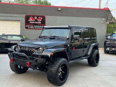 2012 Jeep Wrangler Unlimited for sale at A & J AUTO SALES in Eagle Grove IA